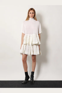 Alaïa women’s white ruffle virgin wool skirt with tiered textured layers and a high neckline short sleeves dress