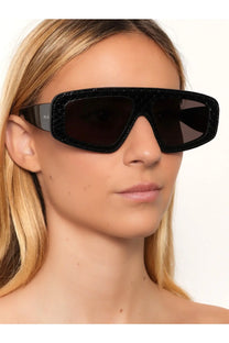Alaïa women’s black crocodile-textured acetate sunglasses with dark lenses and sleek modern frame