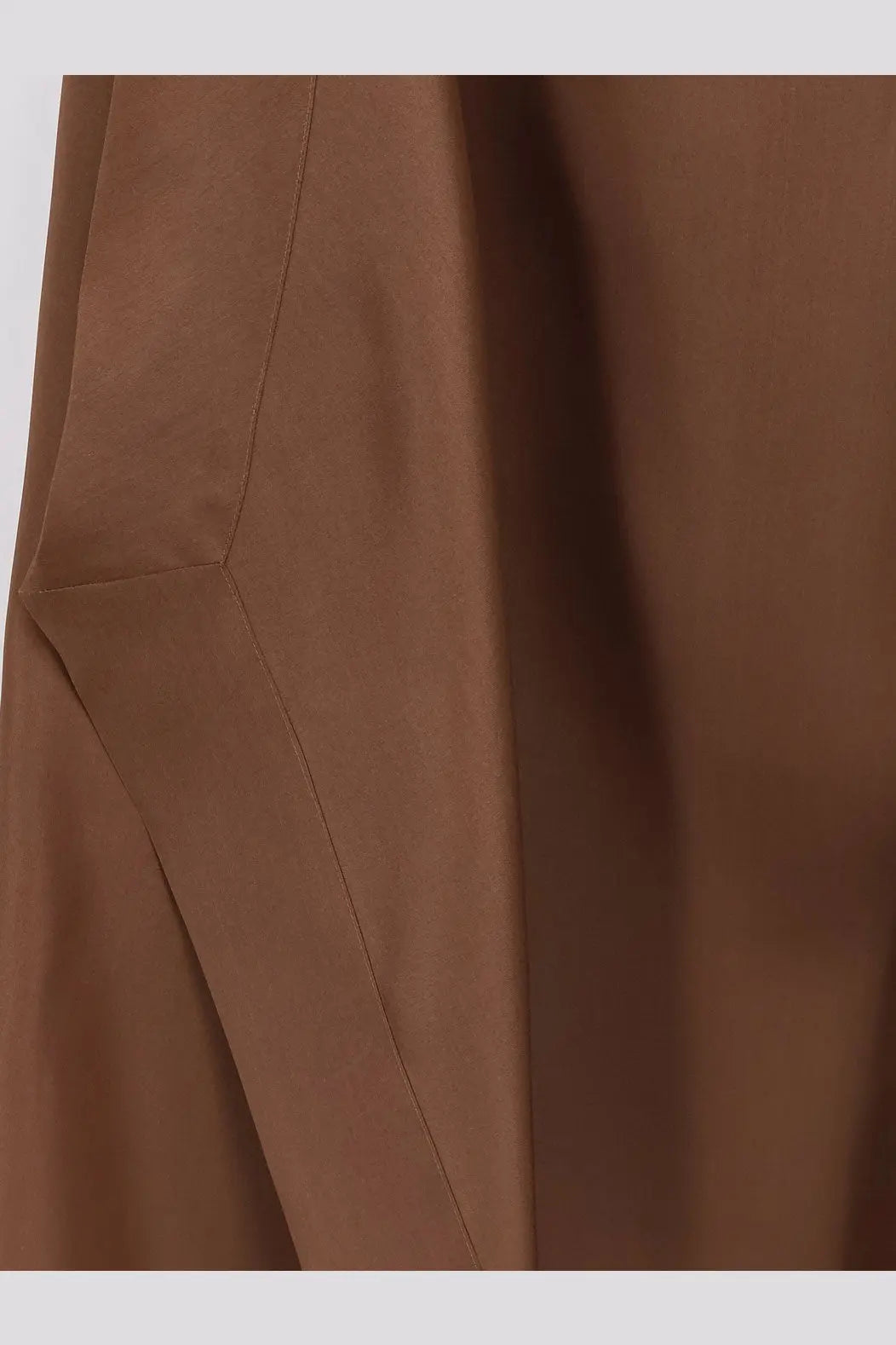 A close-up of smooth rich brown silk fabric with clean stitching on the Alberta Ferretti women’s long dress