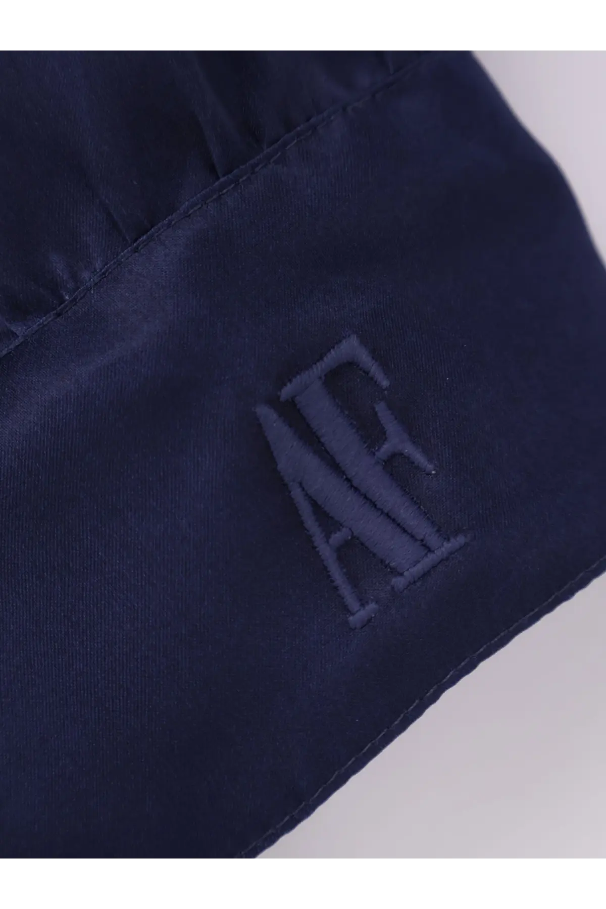 Dark navy satin alberta ferretti womens silk shirt with subtle tonal embroidered logo visible on fabric surface