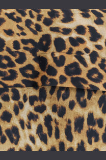 Alberta ferretti women’s silk shirt pattern featuring leopard-print fabric with bold black spots on tan background