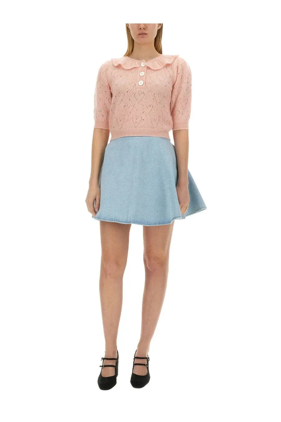 A soft pink knitted top with lace pattern and buttons paired with light blue denim skirt from alessandra rich women’s hearts jersey blue