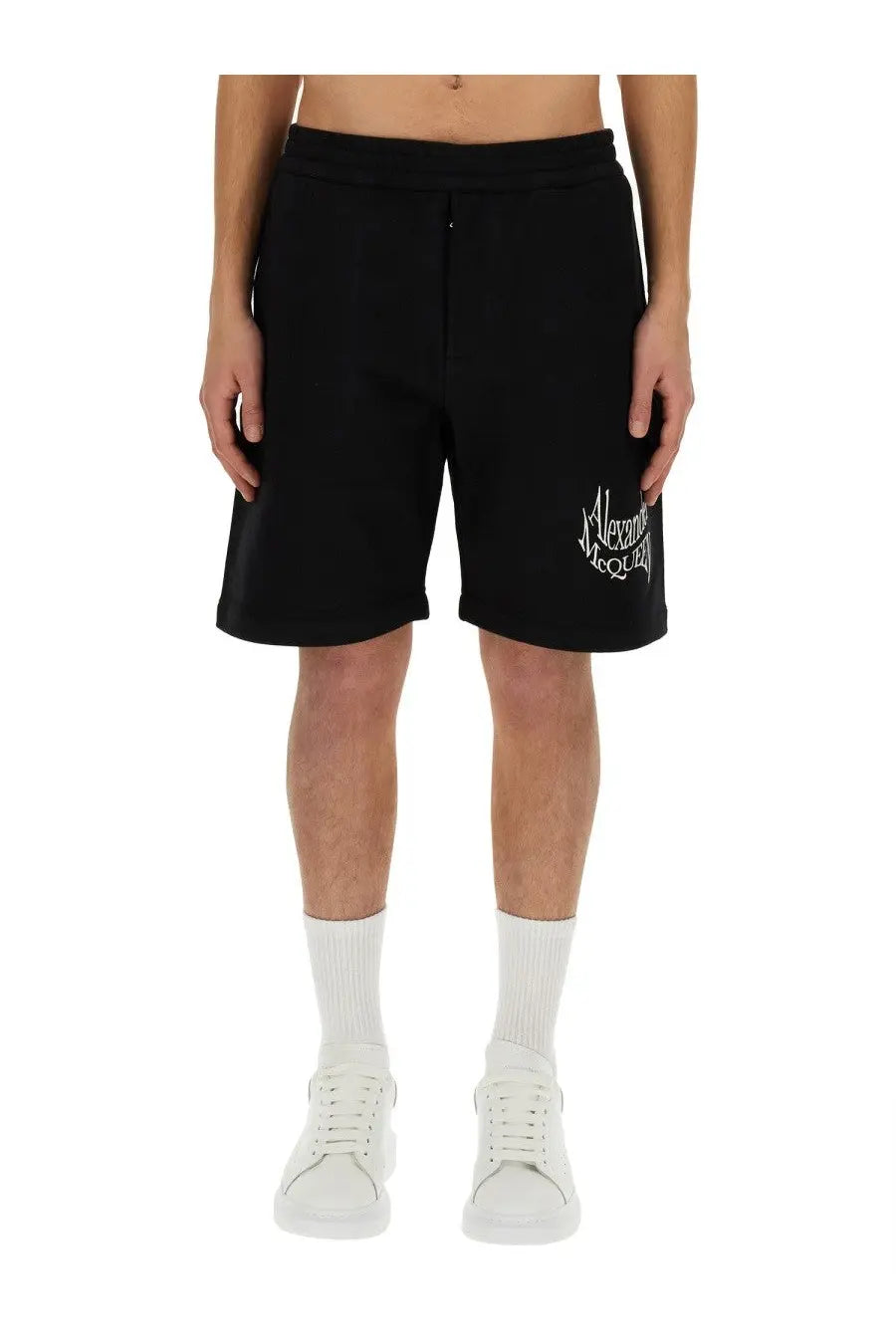 Alexander McQueen men’s Bermuda black sweat shorts with white embroidered logo on left thigh