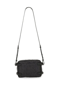 Alexander McQueen men’s black crossbody camera bag with subtle embossed pattern and minimalist leather design