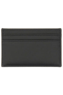 Alexander McQueen men’s black leather card holder with precise stitching and sleek minimalist design