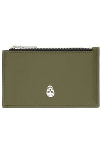 Alexander McQueen men’s olive green leather card holder with silver skull emblem and black zipper for stylish storage