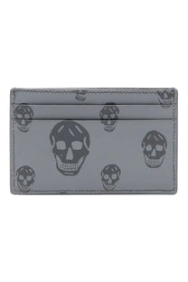 Gray leather Alexander McQueen men’s card holder with repeating black skull pattern for stylish organization