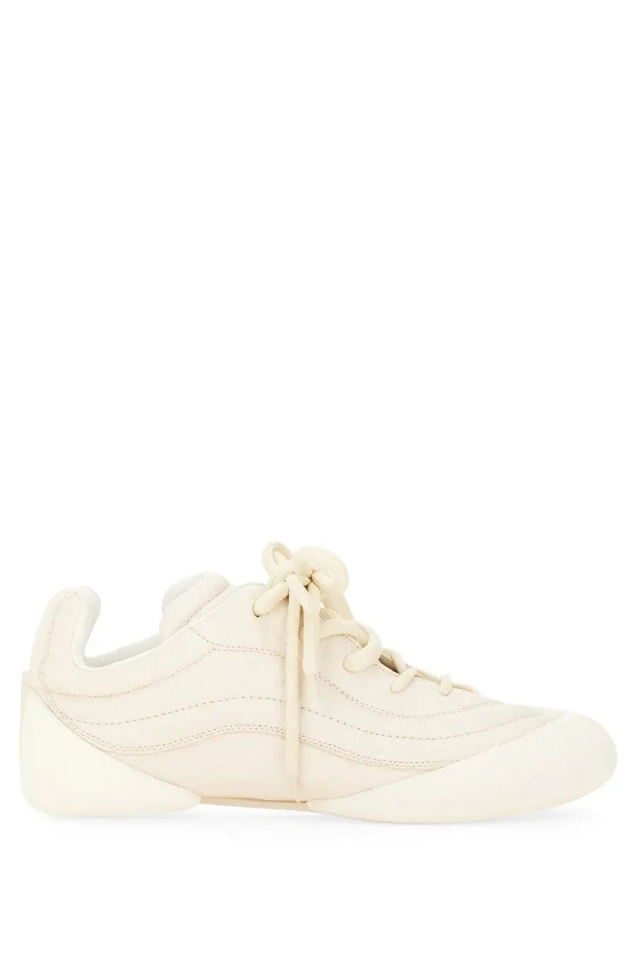 Alexander McQueen men’s flexion sneaker in cream-colored suede with a sleek modern design and subtle stitching details