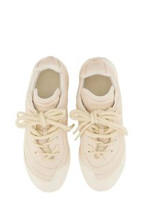 Alexander McQueen men’s Flexion sneaker in cream suede with matching laces and a chunky sole for casual wear