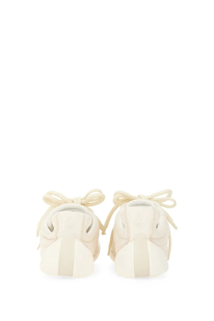 Alexander McQueen men’s flexion sneaker white in cream-colored suede with matching laces tied in bows