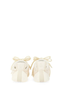 Alexander McQueen men’s flexion sneaker white in cream-colored suede with matching laces tied in bows