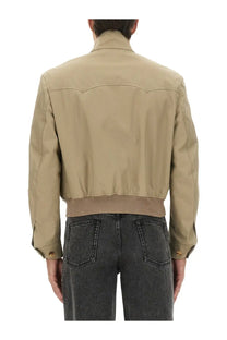Alexander McQueen men’s beige bomber jacket with ribbed waistband and gold-tone button details in croppped harrington style
