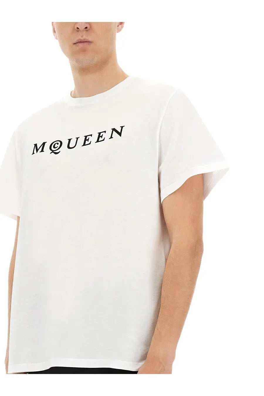 Alexander McQueen men’s white cotton jersey shirt with bold black m at queen logo across the chest