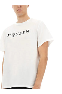 Alexander McQueen men’s white cotton jersey shirt with bold black m at queen logo across the chest