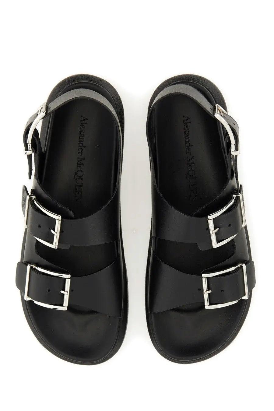 Black Alexander McQueen men’s leather sandal with silver-toned double buckles and a chunky sole