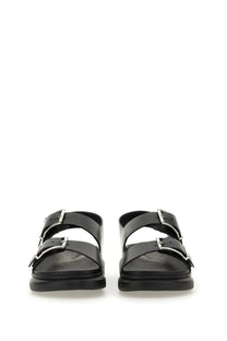 Alexander McQueen men’s black leather sandal with two silver buckle straps and a chunky sole