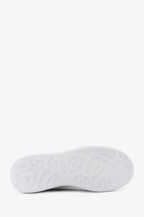 White rubber sole with embossed logo pattern on alexander mcqueen men’s low top black leather sneakers