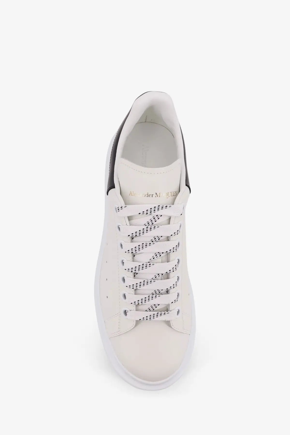 Alexander McQueen men’s low top leather sneaker in white with black accents and patterned laces