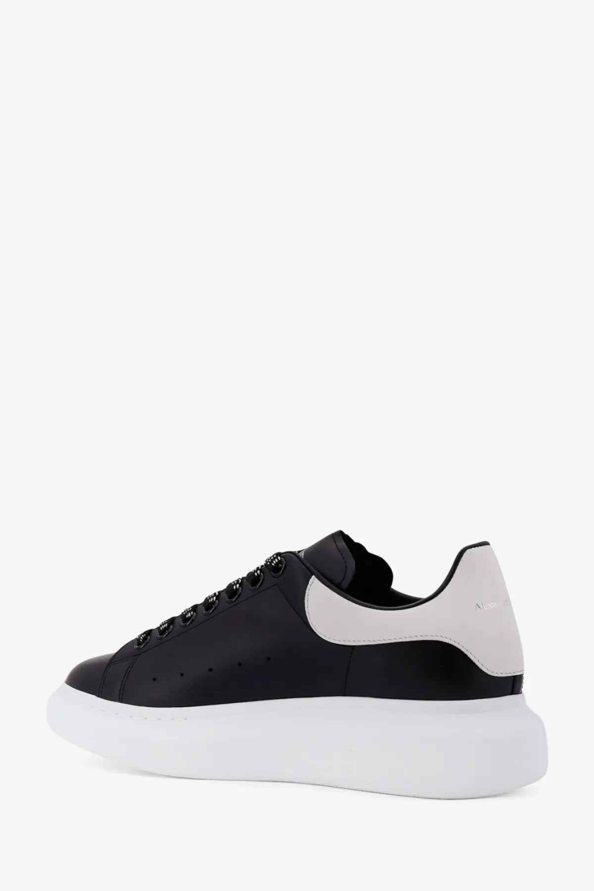 Alexander McQueen men’s low top black and white leather sneakers with chunky sole front view