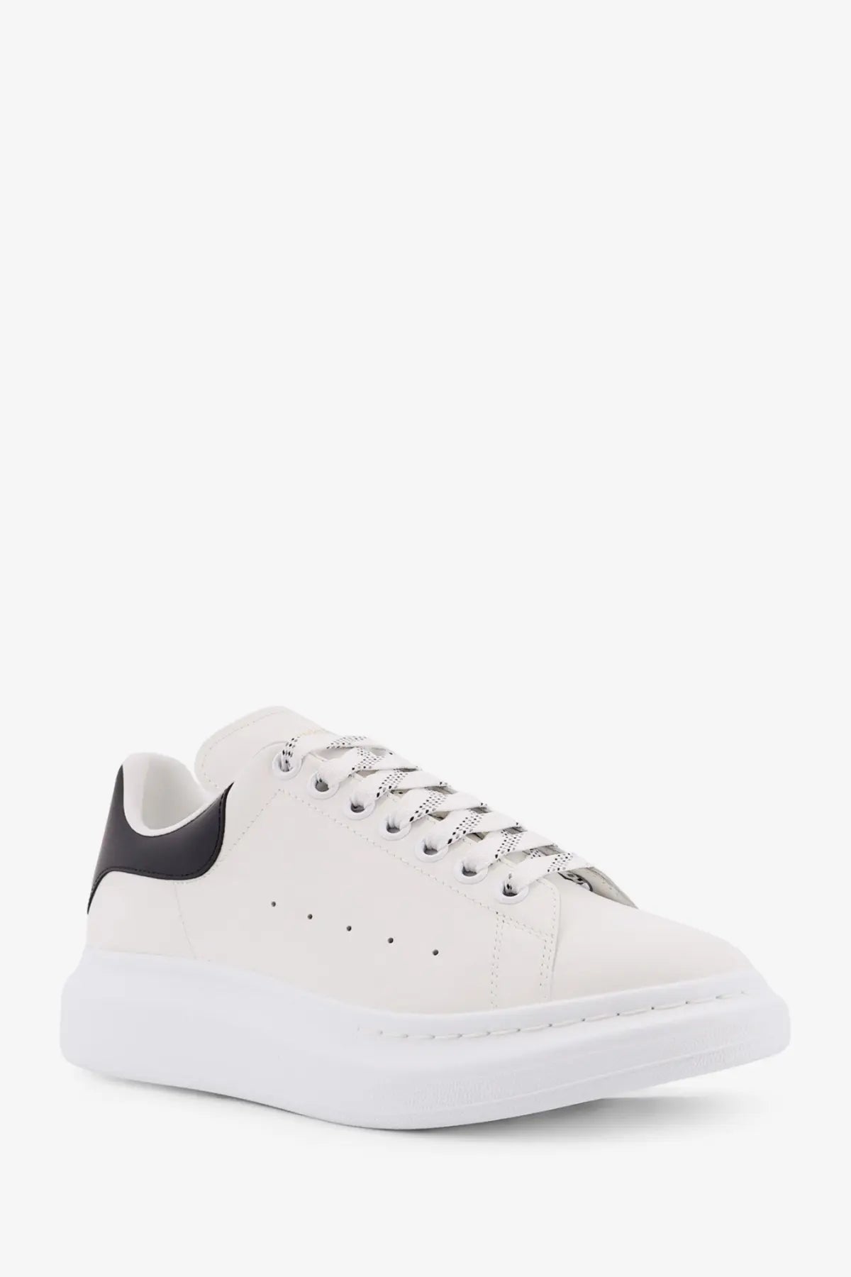 Alexander McQueen men’s low top leather sneakers in white with black heel tab silver laces and chunky white sole
