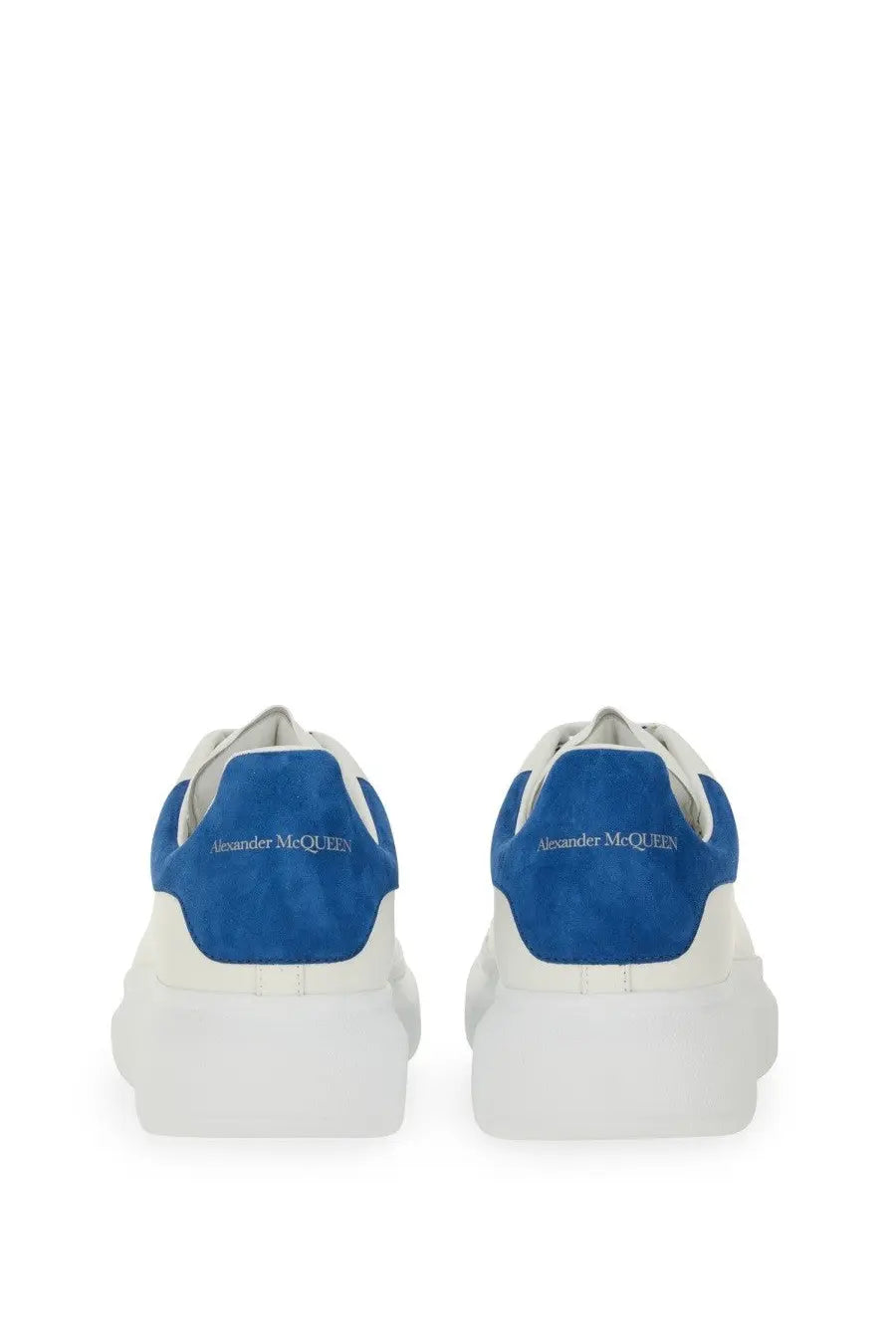 Alexander McQueen men’s oversized leather sneaker in white and royal blue with a chunky sole