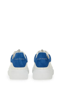 Alexander McQueen men’s oversized leather sneaker in white and royal blue with a chunky sole