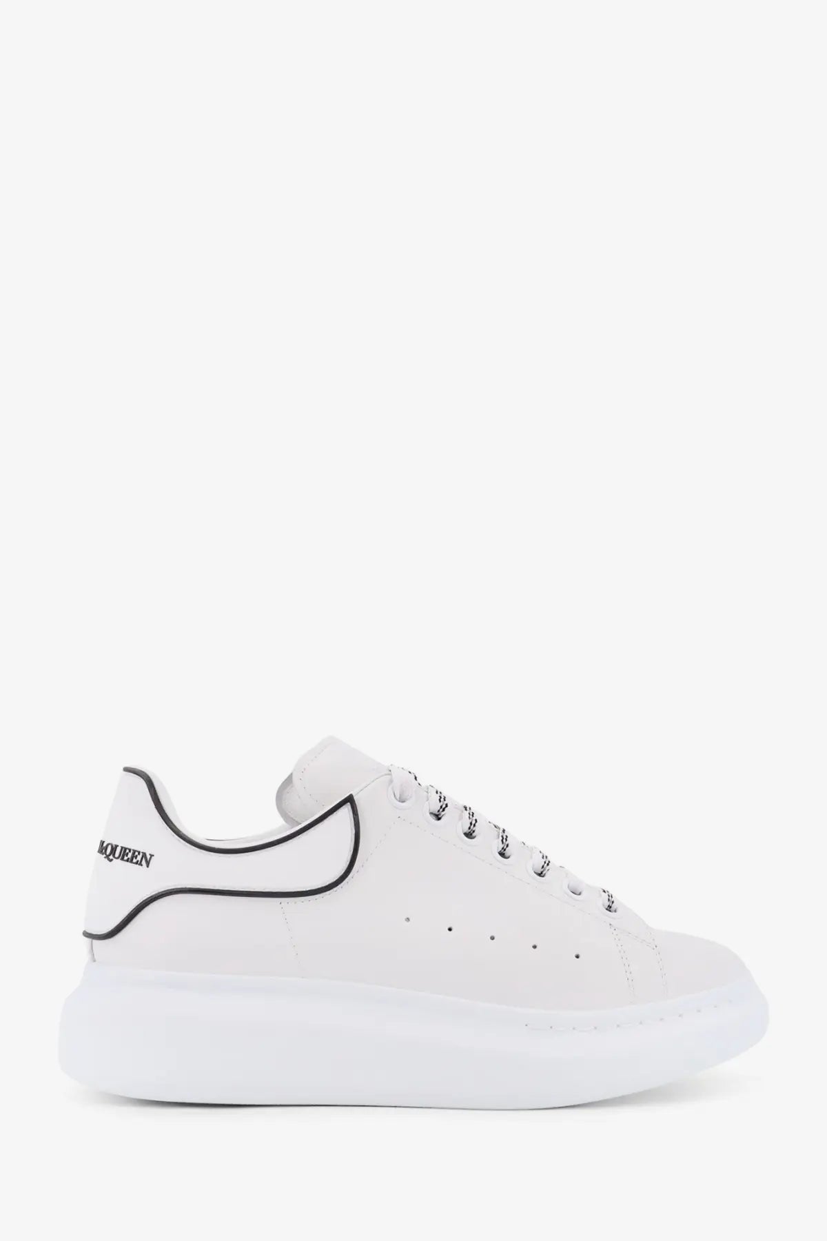 Alexander McQueen men’s oversized low top white leather sneakers with black piping and laces