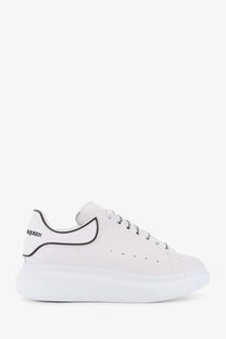 Alexander McQueen men’s oversized low top white leather sneakers with black piping and laces