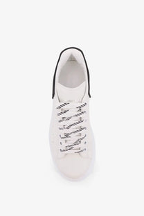 White leather alexander mcqueen men’s oversized low top sneaker with black laces and contrasting black collar trim
