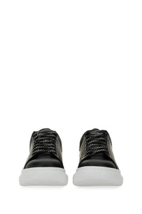 Alexander McQueen men’s oversized sneaker black leather with white rubber soles and patterned laces front view
