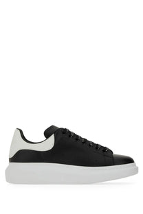 Alexander McQueen men’s oversized sneaker black with glossy leather upper white heel tab and chunky rubber sole