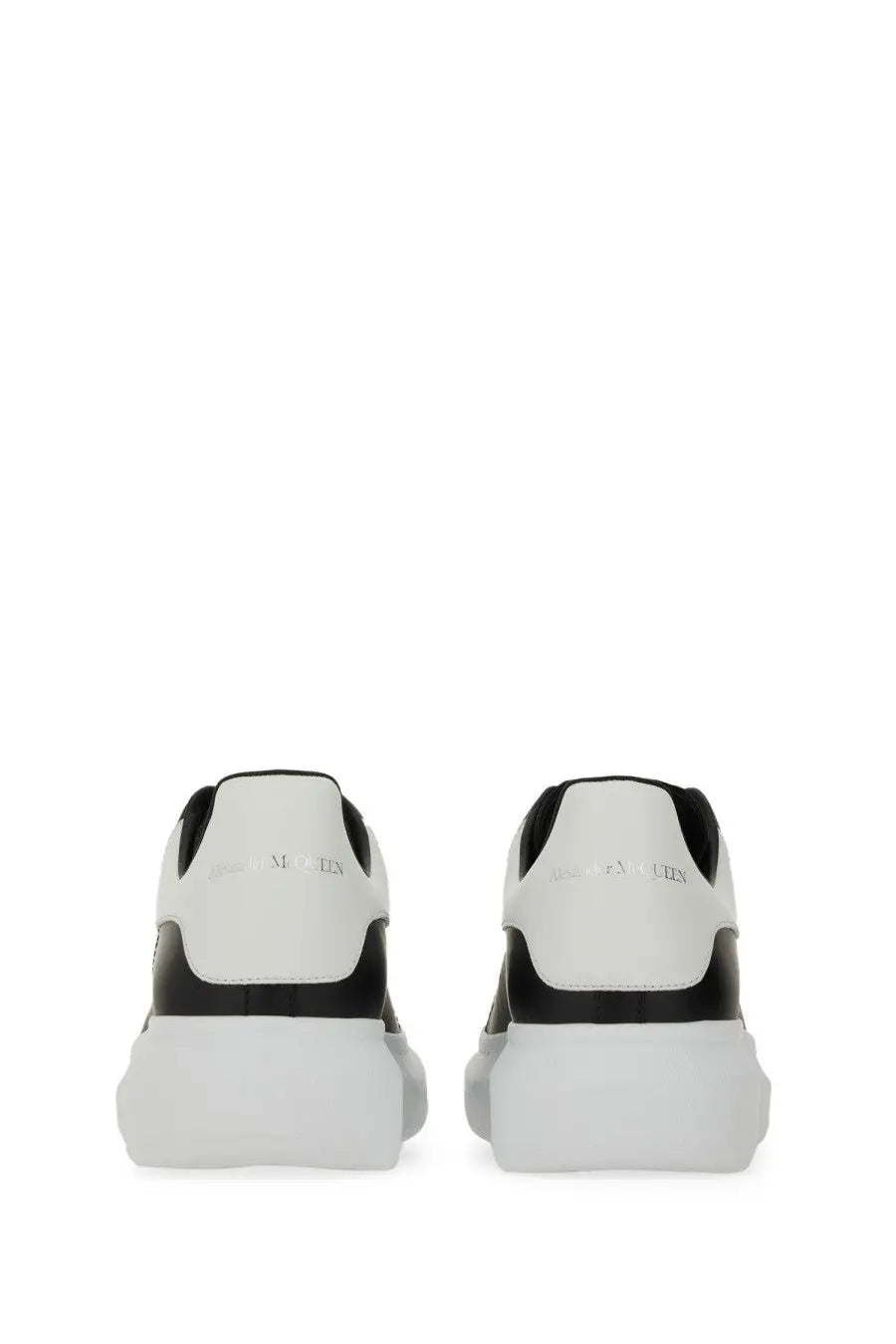 Alexander McQueen men’s oversized sneaker black featuring white and black leather with a chunky sole design