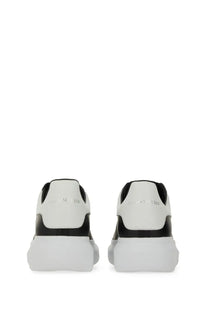 Alexander McQueen men’s oversized sneaker black featuring white and black leather with a chunky sole design