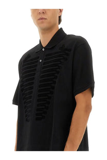 Alexander McQueen men’s black short-sleeved polo shirt with ribcage textured fabric design front view