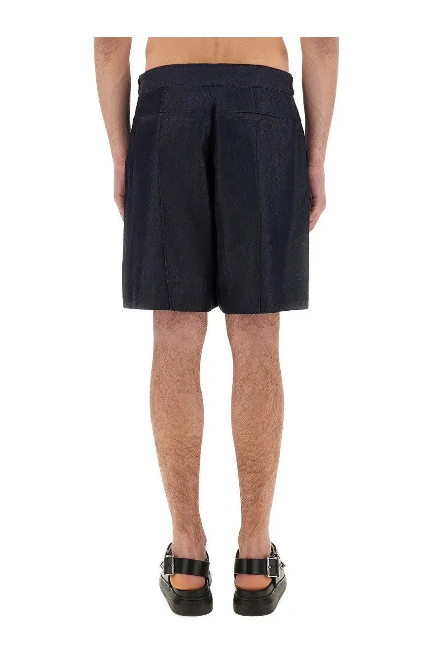 Alexander McQueen men’s short in denim blue featuring dark navy pleated shorts with tailored waistband and structured design