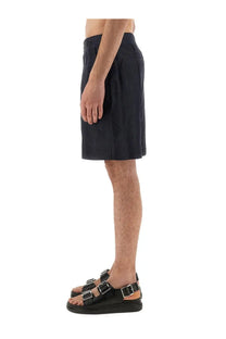 Alexander McQueen men’s dark navy denim blue tailored pleated shorts with belt loops for a stylish fit