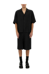 Black short-sleeved button-up shirt with subtle textured weave and classic collar by Alexander McQueen