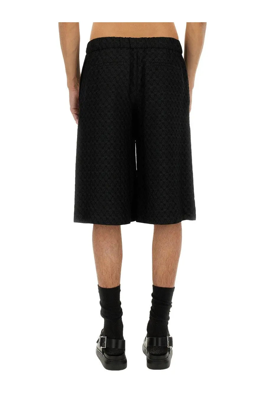 Alexander McQueen men’s black jacquard shorts with skull pattern textured fabric and elastic waistband
