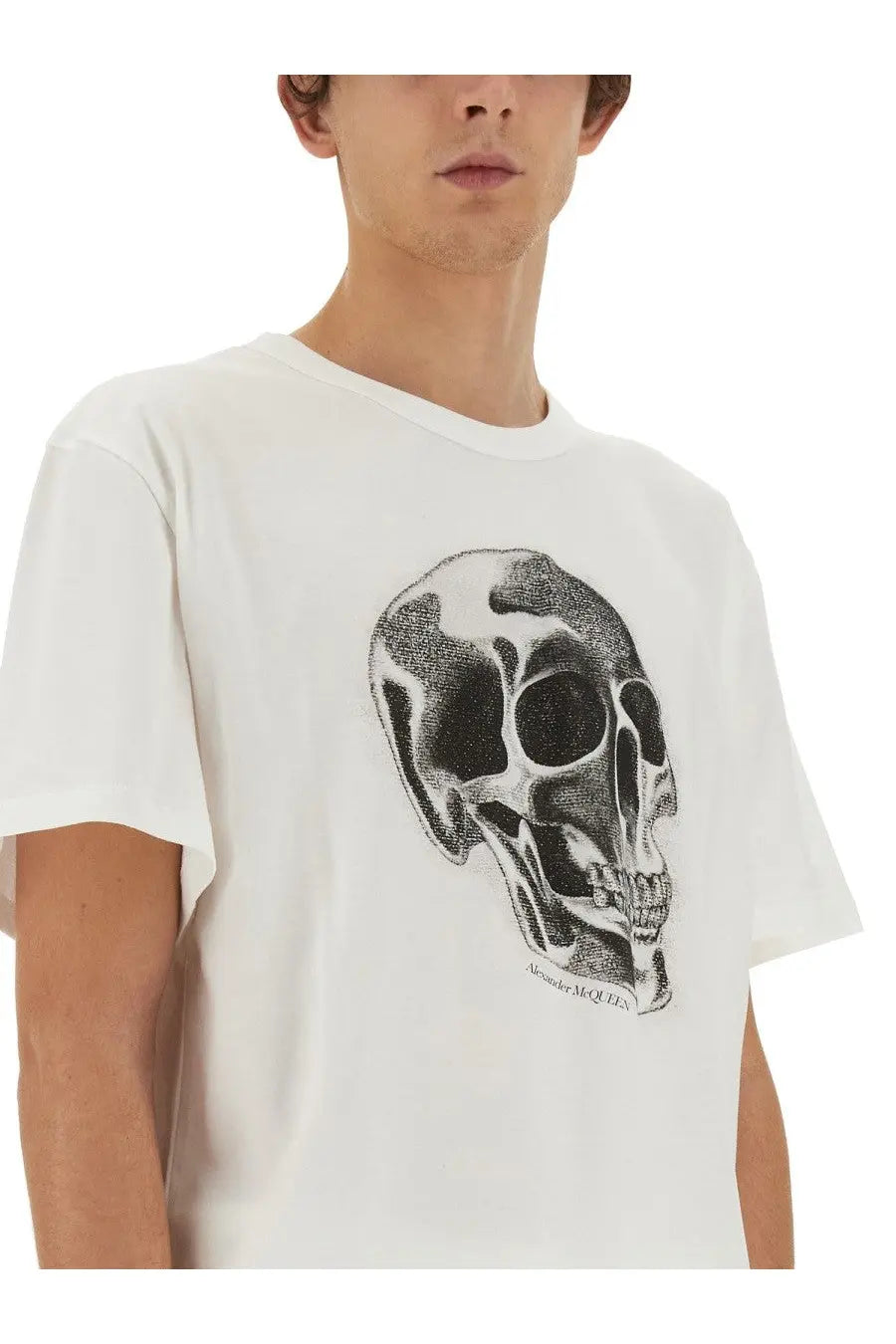 White cotton alexander mcqueen men’s t-shirt with detailed black and white skull graphic and signature beneath it