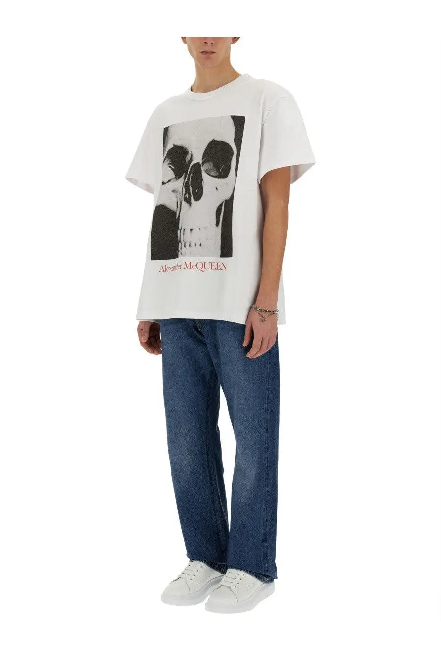 White alexander mcqueen men’s cotton tee featuring a bold skull graphic print on front