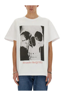 Alexander McQueen men’s white t-shirt with black and white skull graphic and red brand name print below