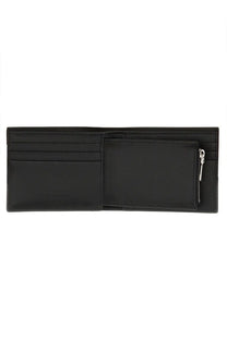 Black leather Alexander McQueen men’s wallet with multiple card slots and a zippered compartment for organization