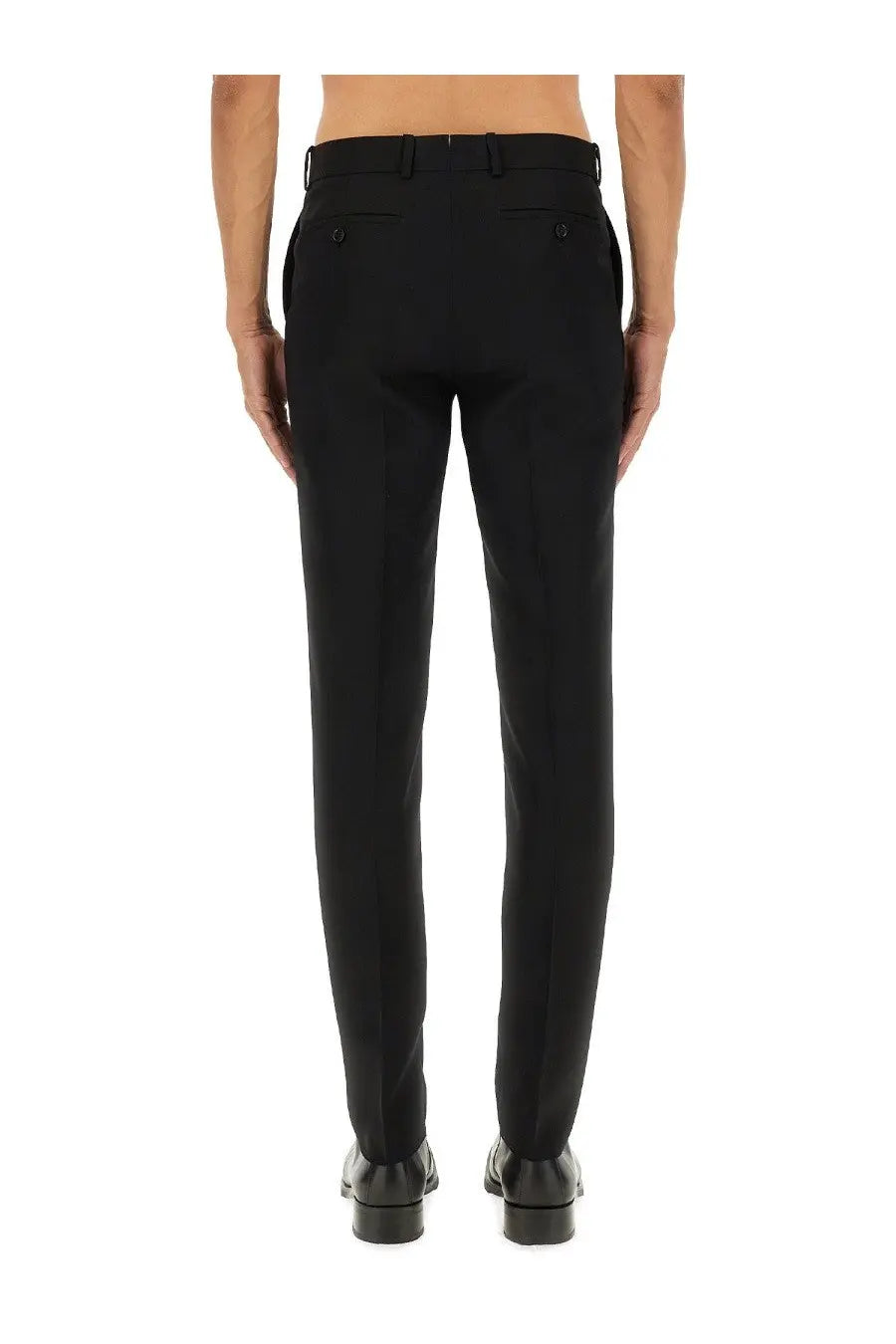 Black tailored wool trousers by Alexander McQueen with sleek straight-leg cut and subtle stitching details