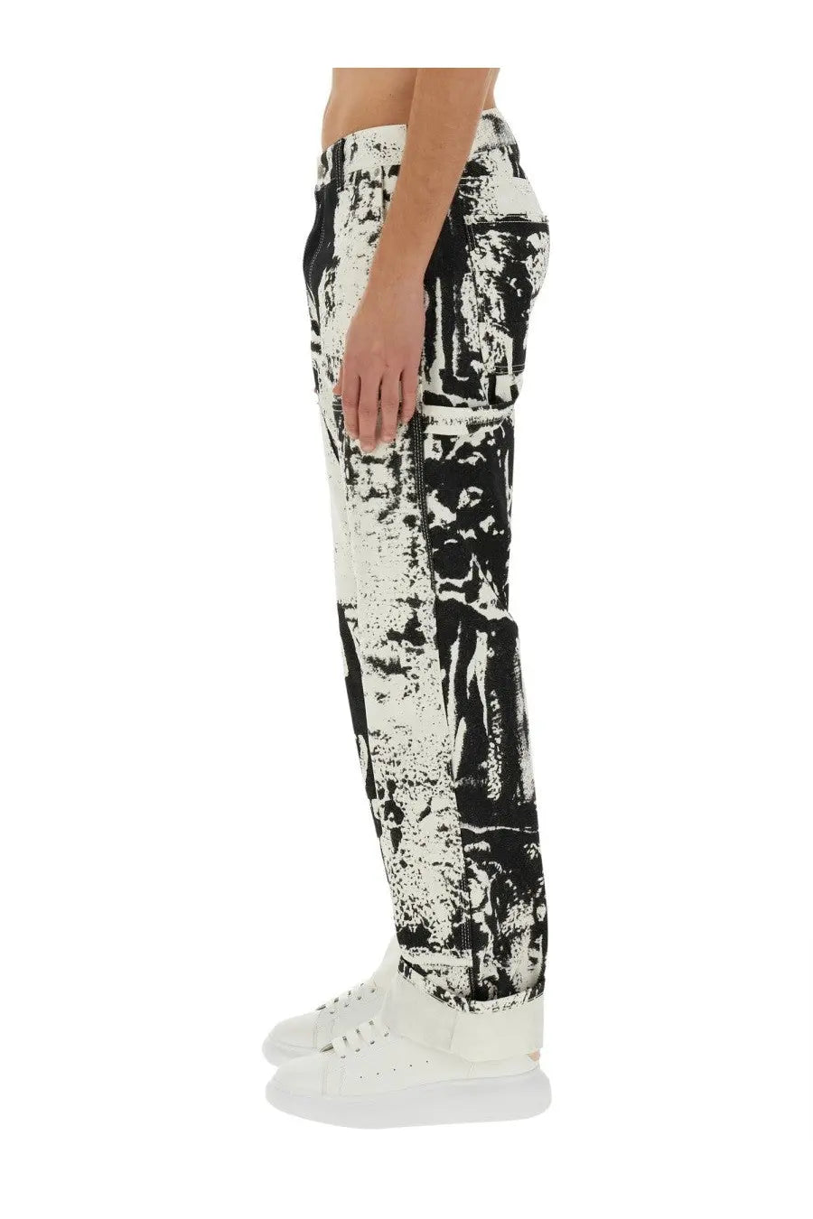 Alexander mcqueen men’s white denim jeans with black and white graphic print and distressed abstract design