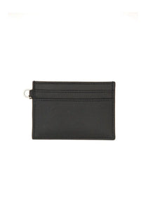 Alexander McQueen women’s black leather card holder sling with a silver metal ring on the top left corner