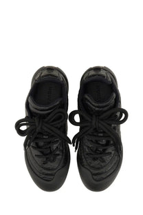Black quilted leather alexander mcqueen women’s flexion sneaker with glossy finish and laces tied in bows