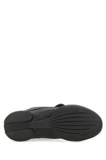 Black rubber sole with textured tread and embossed marc jacobs branding on alexander mcqueen women’s flexion sneaker black