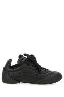 Alexander McQueen women’s flexion sneaker black textured leather with sleek modern design and subtle stitching details