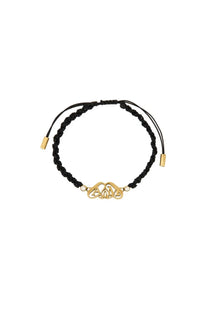 Alexander McQueen women’s friendship bracelet in black braided cord with gold toned celtic knot charm and white beads