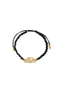 Black braided cord friendship bracelet by Alexander McQueen with gold-toned celtic knot charm and metal clasps